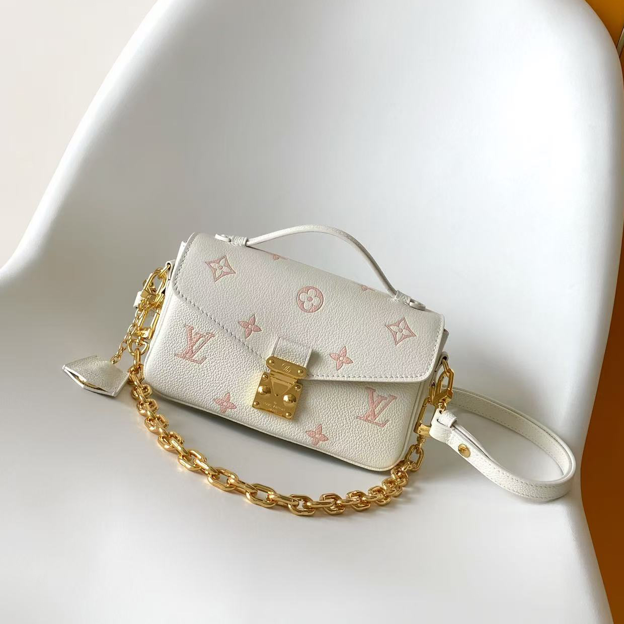 M27575 LV POCHETTE MÉTIS EAST WEST